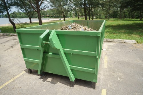 Workers arranging waste segregation and bins during a clearance